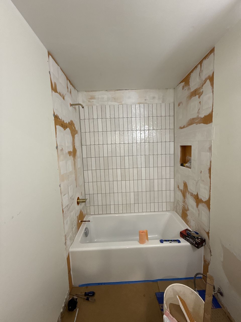 Vertical white wall tile installation